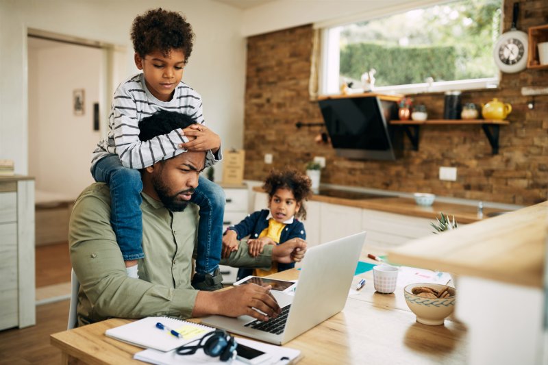 A busy mortgage broker works from home.