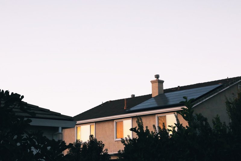 An energy efficient house with solar panels thanks to green mortgage lending.