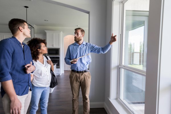 Photo of a millennial couple looking to purchase a home. Credit: iStockphoto.com/SDI Productions