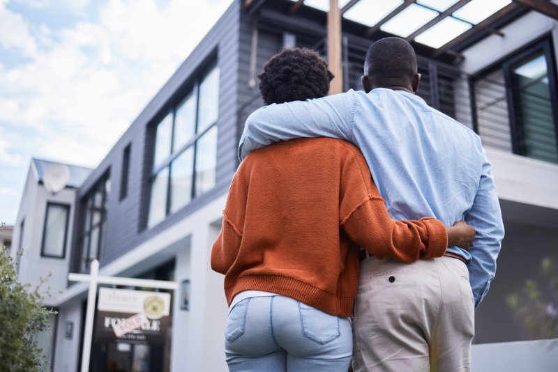 A couple admiring their new home.