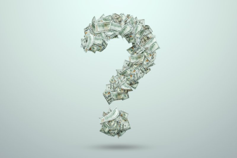 A question mark made of dollar bills.