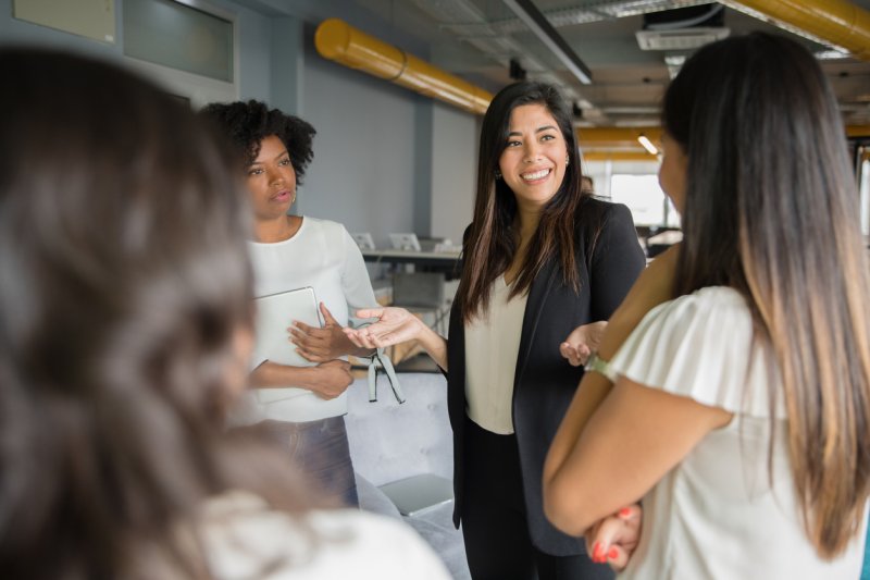 A group of women professionals networking.