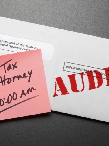 A letter from the IRS with red "AUDIT" stamp